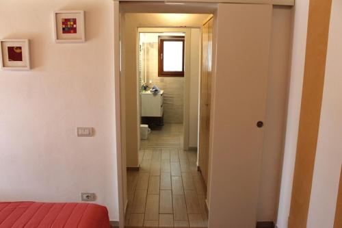 Ένα ή περισσότερα κρεβάτια σε δωμάτιο στο Rustico Valentina