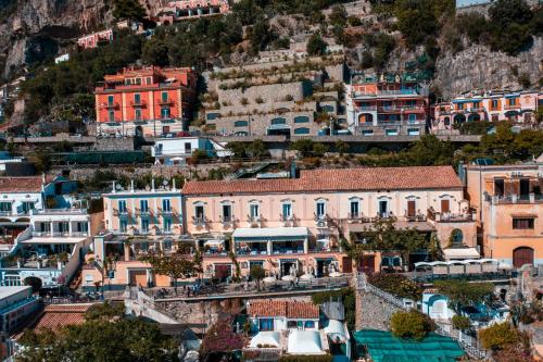 a view of a town on a mountain at Albergo California in Positano