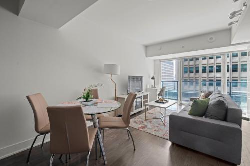 a living room with a couch and a table at Modern 1BD Apartment with Balcony DT Toronto in Toronto