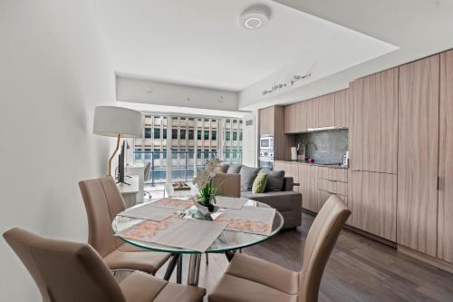 a living room with a table and a couch at Modern 1BD Apartment with Balcony DT Toronto in Toronto