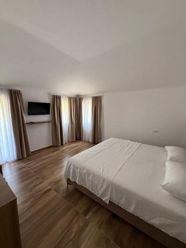 Postel nebo postele na pokoji v ubytování Hotel Viluni