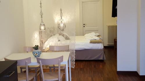 Postel nebo postele na pokoji v ubytování La Corte Dei Cavalieri
