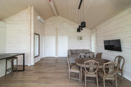 a dining room with a table and chairs at Royal Horse Resort in Balkasodis