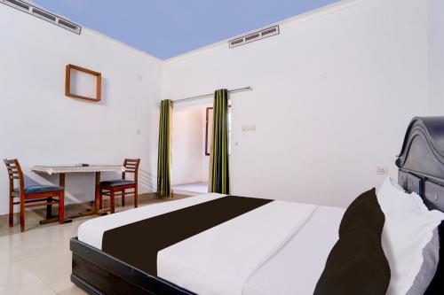 Postel nebo postele na pokoji v ubytování Hotel O Libra Regency