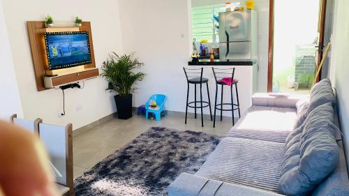 Posezení v ubytování Lugar tranquilo para sua família