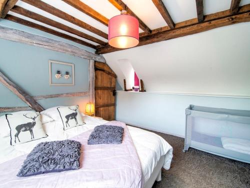 a bedroom with a bed in a room with wooden ceilings at Traditional Cottage with private terrace in Amas