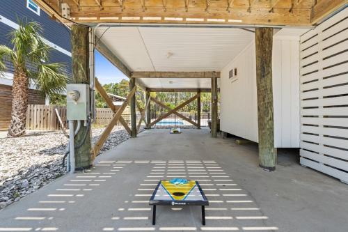 a building under construction with a table in the middle at Stay Salty by Coastline Vacation Rentals in Cape San Blas