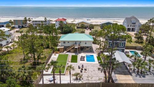 an aerial view of a resort with the beach at Stay Salty by Coastline Vacation Rentals in Cape San Blas