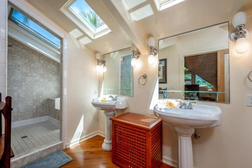 a bathroom with two sinks and a shower at Paradiso Hale in Princeville