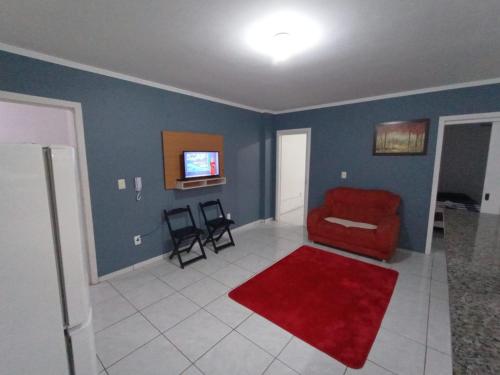 Televisyen dan/atau pusat hiburan di Hotel Pousada Roma