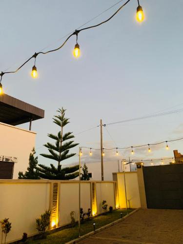 a string of lights hanging over a house at HappyNice guesthouse in Andoharanofotsy