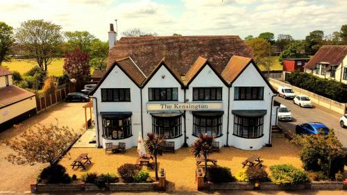 a large white building with a roof at The Kensington in Great Yarmouth