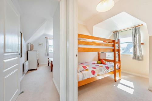 a bedroom with a bunk bed in a house at St Brides Bay Sea View in Broad Haven