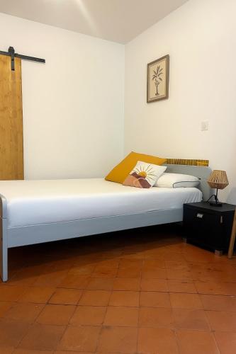 a bedroom with a large bed in a room at Le nid Cévenol in Sumène