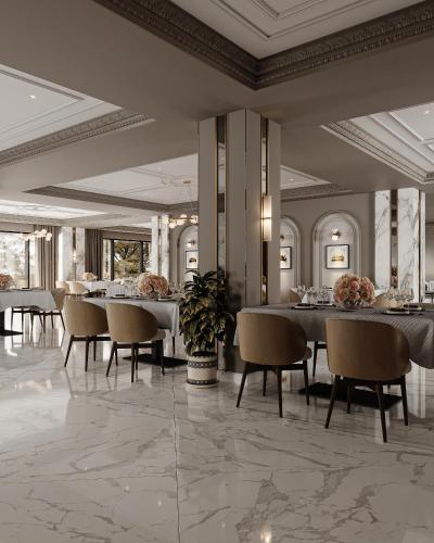 a dining room with tables and chairs and ceilings at Shirvan Grand Hotel Shamakhi in Şamaxı