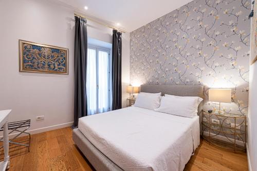 Postel nebo postele na pokoji v ubytování Piazza Venezia Suite and Terrace