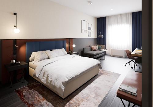 a bedroom with a large bed and a desk at Crowne Plaza Istanbul - West in Istanbul