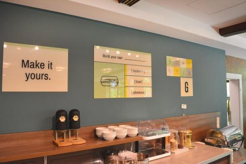 a store with a counter with shoes on it at Garner Hotel Frankfurt - Palmengarten by IHG in Frankfurt/Main