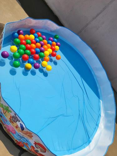 a blue cake with colorful balls on top of it at Villa Machado Chaves in Vila Nova da Veiga