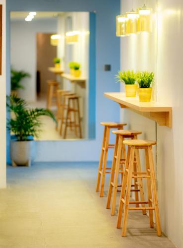 a row of bar stools in an office at Cozypod Rentals in Sagcahan