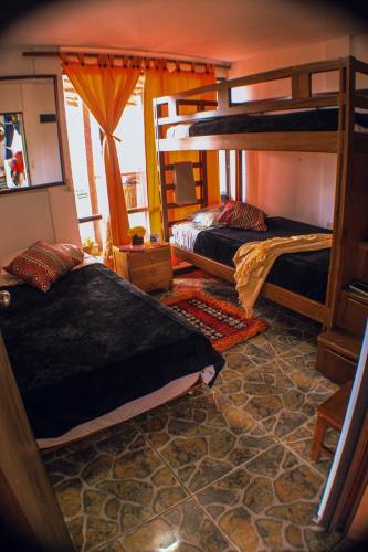 a room with two bunk beds in it at Balcones del Lago de Tota in Sogamoso