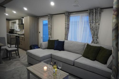 a living room with a couch and a table at Neptune in Parkeston