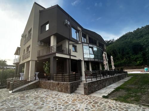 a large building with a lot of windows at Vila Premiere Bistro-Spa in Piatra Neamţ