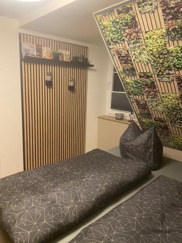 a bedroom with a bed and a large door at Ferienwohnung Maria mit Elbblick in Coswig