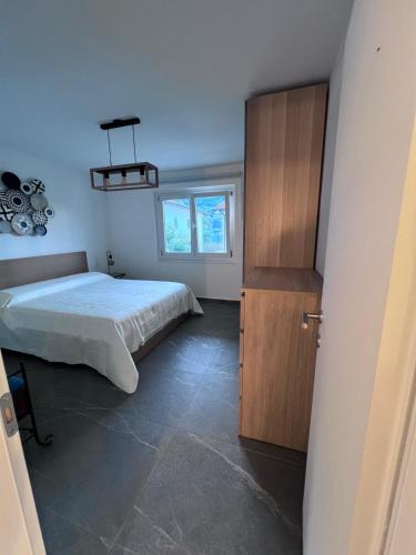 Postel nebo postele na pokoji v ubytování Casa Oasi Brusino