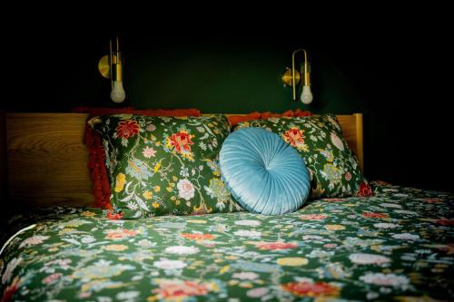 a blue pillow sitting on top of a bed at NEW - Dicht bij de zee en Brugge in De Haan