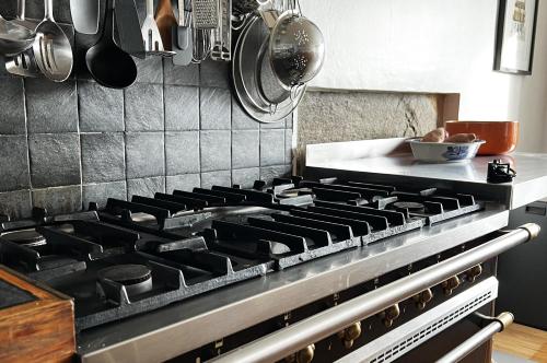 a stove top in a kitchen with pots and pans at Old Schoolhouse in Inveraray