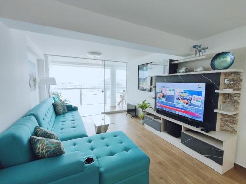 TV a/nebo společenská místnost v ubytování Confortable con vista al mar de Naplo, Pucusana