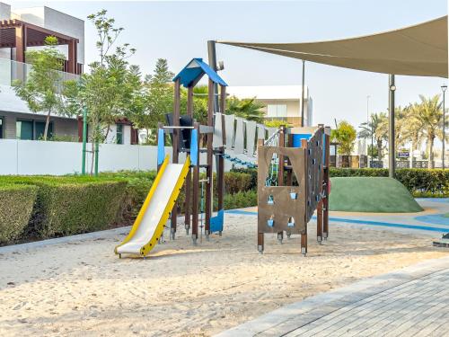 a playground in a park with a slide at Luxurious Villa on Saadiyat for Large Groups and Families in Abu Dhabi