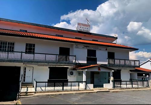a white building with a sign on top of it at M&L Gerês in Salamonde