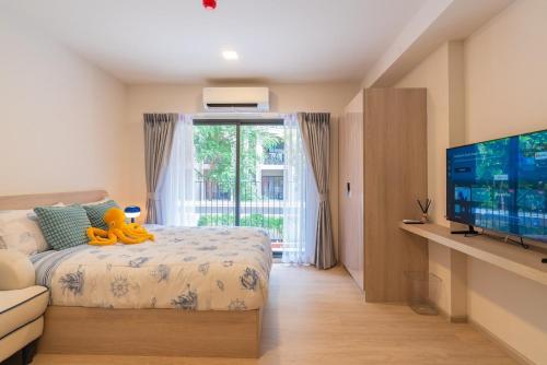 Ένα ή περισσότερα κρεβάτια σε δωμάτιο στο Cabanas Hua-Hin by H