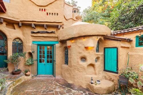 an exterior of a house with blue doors at Casa Gaudí en Tepoztlán in Tepoztlán