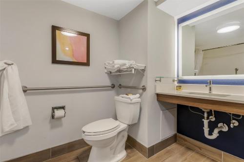 a bathroom with a toilet and a sink at Best Western Plus Lexington Inn in Lexington