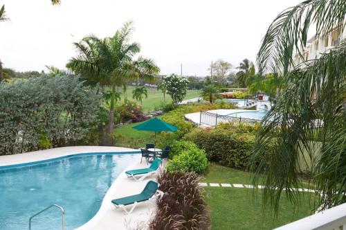 a view of a swimming pool in a resort at ZenBreak Island Time at El Sol in Christ Church