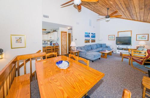 a living room with a table and a couch at De-Duck-Tible - D0318 in Duck