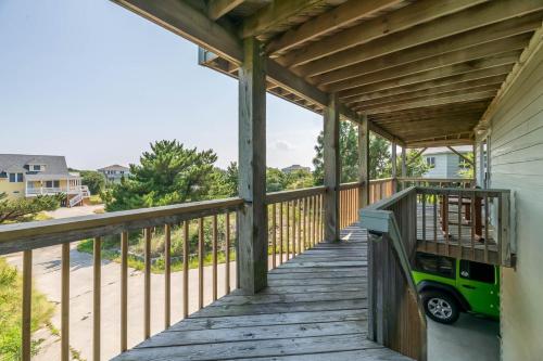 a wooden porch with awnings on a house at De-Duck-Tible - D0318 in Duck