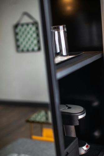 a close up of a desk with a glass on it at Renaissance Chicago North Shore Hotel in Northbrook