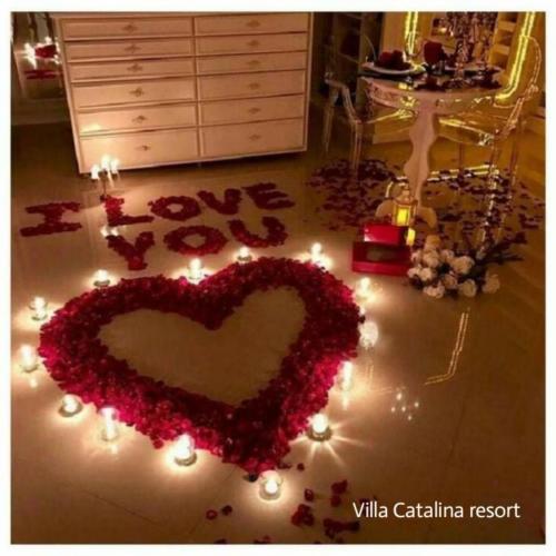 a heart made out of flowers and lights on the floor at Villa catalina Bora 2 Resort in Nabas