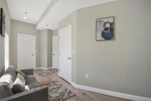 a living room with a couch and a painting on the wall at The Castle in Washington, D.C.