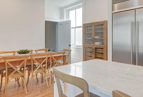 a kitchen and dining room with a table and chairs at The 200 South St - King Ste 9 in Charlottesville