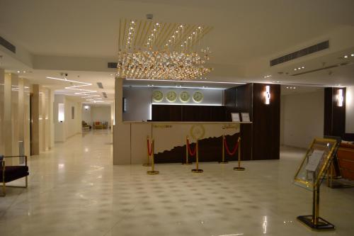 a large lobby with a chandelier in a building at فندق الشهباء الفيحاء Hotel Al Shahba Al Faiha Jeddah in Jeddah