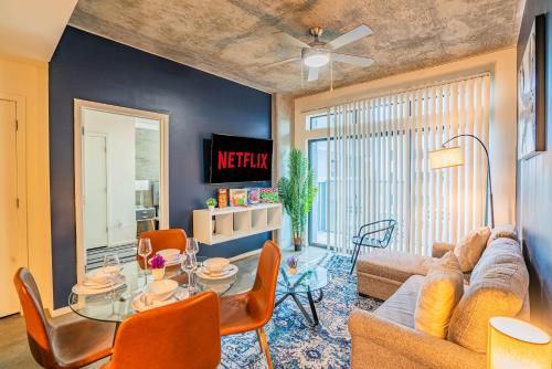a living room with a couch and a table at Charming 2BD - Central Downtown - Gym, Pool, Parking in Phoenix