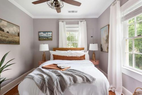 a bedroom with a bed and a ceiling fan at Harvest Moon in Atlanta