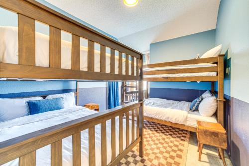 two bunk beds in a room with a bed at Game Room, Hot Tub and Pool! Grand Prairie Getaway in Grand Prairie