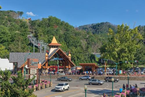a group of cars parked in front of a amusement park at Moonlit Pines by American Patriot Getaways in Oldham