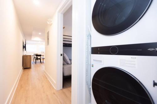a washer and dryer in a room with a dining room at 3 BDR Renovated Condo The Beach1 block in Wildwood